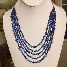 This Is A Gorgeous Hand Made Five Strand Genuine Sodalite, Turquoise, And Glass Bead Bead Necklace. It’s Is Very Detailed And Labor Intensive. The Chain Is Made Of Silver Tone Base Metal. In Excellent Vintage Condition. Artisan Blue Necklace With Gemstone Beads, Bohemian Blue Lapis Lazuli Beaded Necklace, Artisan Blue Gemstone Beaded Necklaces, Artisan Blue Beaded Necklaces With Gemstone Beads, Artisan Blue Beaded Necklace With Natural Stones, Artisan Blue Beads For Jewelry Making, Artisan Blue Gemstone Beaded Necklace, Artisan Blue Faceted Beads, Elegant Blue Turquoise Necklace With Colorful Beads