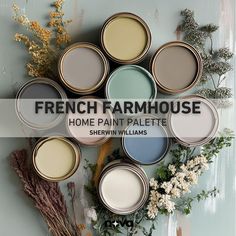 the french farmhouse home paint palette is shown with flowers and herbs in front of it