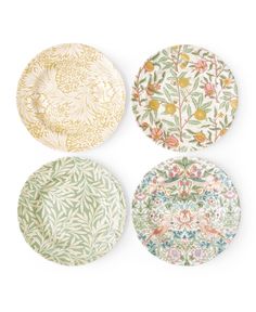 four plates with different designs on them