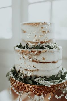 a three tiered cake sitting on top of a table