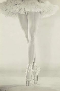 a black and white photo of a ballerina dancer