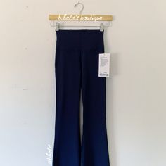 Description: Lululemon Groove Super High-Rise Flared Pant *Nulu In True Navy (Trnv). Classic Navy Blue Hue. Og Old Style; Discontinued In 2021. Special Collector’s Item. Rare, Htf Item In Nwt Condition. Fantastic For Yoga. Great For Casual Days, Too! Made From Buttery Soft Nulu (Like Align Leggings). Sold Out. Size: Size 2 ~42" Length (Measured From Top Of Waist To Bottom) ~10" Width (Measured Directly Across Waist) ~32.5" Inseam ~9.2" Width Of A Single Leg [All Measured Flat & All Are Approxima Fitted Wide Leg Blue Activewear, Navy Athleisure Pants For Yoga, Blue Fitted Wide Leg Activewear, Blue Wide Leg Athleisure Activewear, Blue Wide Leg Workout Bottoms, Sporty Blue Wide Leg Yoga Pants, Navy Stretch Yoga Pants, Navy Athleisure Yoga Pants, Fitted Navy Yoga Pants