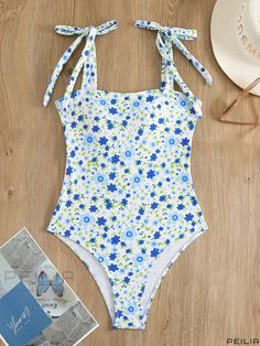 Peilia - Womens Ditsy Floral Print Tie Shoulder One-piece Swimsuit: Fashionable High Cut Bathing Suit with Medium Stretch - Ideal for Stylish Swimwear Enthusiasts White Floral Print One-piece For Spring, Blue Sleeveless Floral One Piece, Sleeveless Blue Floral One Piece, Blue Floral Print One-piece For Vacation, Sleeveless Blue Floral One-piece, Floral Print One-piece Swimwear For Beach Season, Floral Print Sleeveless One-piece Swimsuit, Beachy Printed One-piece Swimwear, Beachy One-piece Floral Print Swimwear