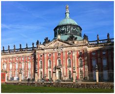 an old building with a green dome on top