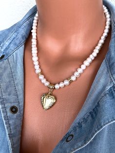 Fresh Water Pearl Necklace with Gold Plated Heart Shaped Locket Pendant This elegant necklace set is a great gift for yourself and your loved ones. Made from natural pearl beads. All metal ornaments are gold plated and won't get darker in time! FREE SHIPPING - All orders get shipped within 1-2 business days. - 5-10 days of delivery time Returns are allowed 14 days after the delivery, however, the cost of delivery lies on the buyer. For more bracelets and necklaces!: https://finecrystalsdesign.etsy.com How to care for your necklace: * Avoid getting moisture, alcohol and perfume, if you do please dry the product with clean cloth. Please take off your necklace before swimming or taking shower. Pearl Necklace With Heart, Best Gift For Women, Necklace With Heart, Hematite Necklace, Cool Gifts For Women, Personalized Pendant, Elegant Necklaces, Cool Necklaces, Heart Locket