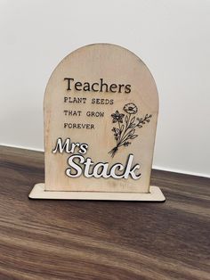 a wooden plaque with the words teachers plant seeds that grow forever