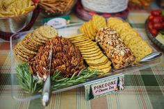 a platter filled with crackers and other snacks