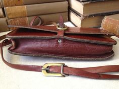 "Vintage Rustic Brown Leather Messenger Saddle Bag Handcrafted Vintage ~~ Scotland Heavy thick harness hide leather, brass buckle closure with leather strap, adjustable shoulder strap. 1 interior compartment. Color is a very is a lovely rustic brown with a beautiful patina. It is not stamped on the handbag, but believe this is made in Scotland, I have another bag listed almost just like this one that is. Perfect size when you just want to travel light, small but large enough to keep your phone, Formal Satchel Shoulder Bag With Leather Strap, Vintage Crossbody Briefcase With Adjustable Strap, Vintage Saddle Bag With Adjustable Strap For Formal Use, Vintage Saddle Bag With Adjustable Strap For Formal Occasions, Vintage Shoulder Bag With Leather Strap For Everyday Use, Leather Bag With Brass Buckle For Everyday Use, Everyday Leather Bags With Brass Buckle, Brown Bags With Brass Buckle For Everyday Use, Vintage Leather Shoulder Bag With Leather Strap