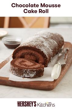 chocolate mouse cake roll on a cutting board