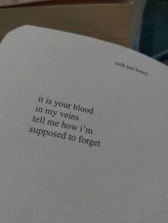 an open book with the words it is your blood in my vens tell me how i'm supposed to forget