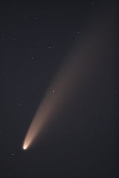 an object is seen in the sky with stars around it and a bright light coming from behind