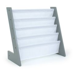 a gray and white book holder with six folded books on the bottom, in front of a white background