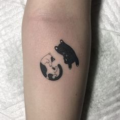 a tattoo on the leg of a woman with two bears and a bear cub in it