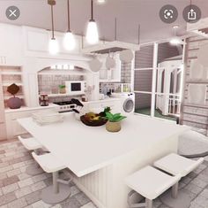 a large white kitchen with lots of counter space