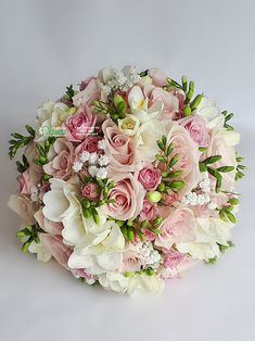 a bridal bouquet with pink and white flowers