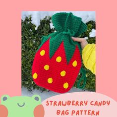 a crocheted strawberry bag with a green bow