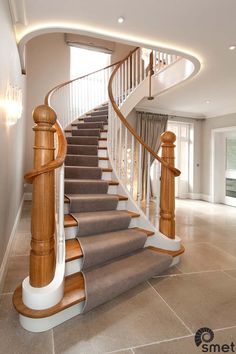 a staircase in a house with carpeted flooring