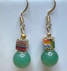 Beautiful green beads are topped with a colorful  Millefiori cube bead. Simple, yet stylish everyday earrings.  These are upcycled beads from select jewelry, mixed with new materials. The ear wires are gold plated. Cheap Handmade Green Earrings, Cheap Everyday Green Earrings, Earring Designs, Coin Earrings, Green Beads, Christmas Earrings, Everyday Earrings, Small Earrings, Jewelry Inspo