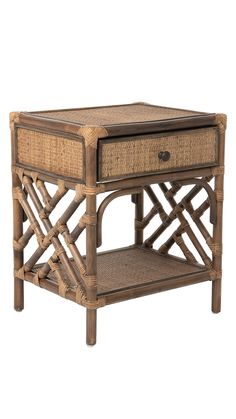 an end table made out of bamboo and wicker with a drawer on the top