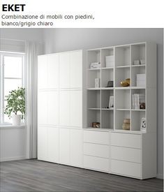 an orange and white bookcase in the corner of a room