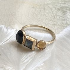 Top of the world This is a pretty 14K gold filled mothers ring. The band is set with three birthstones, in three sizes, Oval, square and round by choice or with the stones on the picture Onyx, labradorite and citrine. (R2613) For more info about gold filled please check our profile. Construction & Dimensions: 14K yellow gold filled, Onyx, labradorite and citrine. Approximate band width: 2.5mm please indicate your requested size in the order. About our jewelry All of artisanfield jewelry coll Gold Stackable Promise Rings With Gemstones, Gold Gemstone Stackable Rings For Promise, Unique Faceted Yellow Gold Ring, Gold Opal Stackable Open Ring, Gold Birthstone Ring With Gemstone For Promise, Gold Crystal Ring With Gemstone In 14k Gold, 14k Gold Crystal Ring With Gemstone, Heirloom Style Multi-stone Stackable Rings For Gift, Heirloom Multi-stone Stackable Rings For Gift