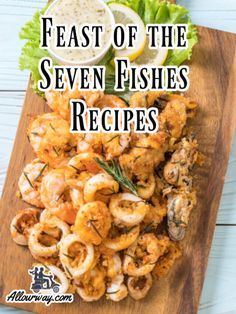 the words feast of the seven fishes recipes on a cutting board