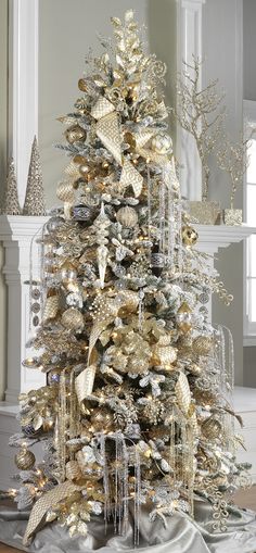 a christmas tree with gold and silver decorations