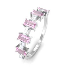 Product Details Embrace modern elegance with this Half Eternity Ring. The alluring Pink Tourmaline gemstone, exude a contemporary charm, complemented by the brilliant sparkle of Moissanite gemstones set horizontally. Celebrate your cherished bond with this captivating Pink Tourmaline and Moissanite ring, a perfect blend of style and sentiment. Product Information SKU SHP-RINGS032222505 Weight 1.68 gm (Approximate) PINK TOURMALINE INFORMATION No.of Stones 10 Pieces Total Weight 1.40 Carat (Approx Rose Gold Pink, Half Eternity Ring, Tourmaline Gemstone, Pink Ring, Signature Jewelry, 18k Yellow Gold Ring, Timeless Jewelry, Moissanite Rings, Pink Tourmaline