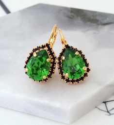 ✤ Can be made with any Swarovski colors. Please contact me.✤ Lever back Earrings. ✤ Made with CRYSTALLIZED™ - High-quality genuine Swarovski crystals.✤ Size approx - teardrop is approx. 2.7 x 1.5 cm.✤ Colors: Green, black Crystal. gold plate metal✤ Stones are hand set in secure prongs✤ One year warranty✤ Nickel Free✤ Bridal - Bridesmaid - Bulk Order Discounts Available Please Contact Me✤ Processing Time is 2-3 business days. I make the jewelry when it's ordered.✤ Worldwide fast delivery. USA: I Green Drop Earrings For Evening Bridal Wear, Green Bridal Earrings For Evening, Green Dangle Teardrop Earrings For Party, Green Jeweled Party Earrings, Green Crystal Wedding Earrings With Ear Wire, Green Gemstone Earrings For Party, Green Teardrop Bridal Earrings, Green Sparkling Stones Earrings For Party, Formal Green Teardrop Gemstone Earrings