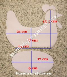 the measurements of a chicken cut out from paper