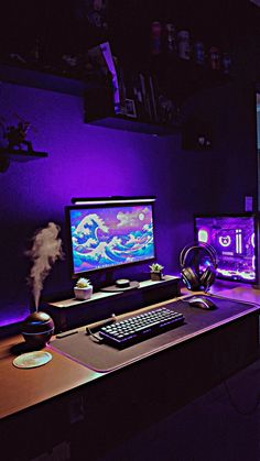 a computer desk with two monitors and a keyboard on it in front of a purple light