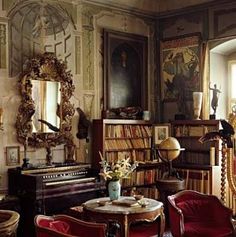 a living room filled with furniture and a piano