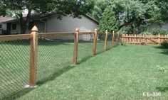 a wooden fence in front of a house