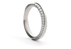 A delightful diamond addition to our Mobius band offering. The sweeping circular curve around the ring is pavé set with a wide line of white diamonds. An elegant ring for everyday, it is a great option for an engagement or wedding band. Created with comfort in mind, the diamond settings are only on the outer face of the ring and are inset to sit flush with the band. Seen here in platinum this ring can also be made in 18ct white, rose or yellow gold.