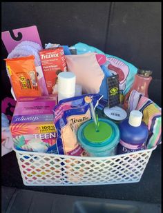 a white basket filled with lots of different items