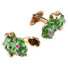 The frog cufflinks are beautifully rendered in Guilloche enamel in vibrant shamrock green color layered over 18K patterned gold and inset with exquisite rubies (set upside-down for a dramatic effect). Guilloche (Basse Taille) vibrant green enamel Natural rubies total weight 0.30 carats 41.50 grams 18K yellow gold Leon Mege, Vintage Cufflinks, Silver Cufflinks, The Frog, Green Enamel, Gold Enamel, Stone Cuts, Natural Ruby, Gold Design