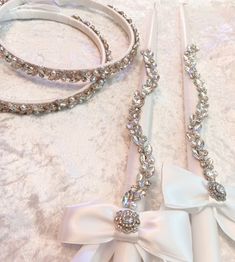 two wedding garters, one with a bow and the other with a headband