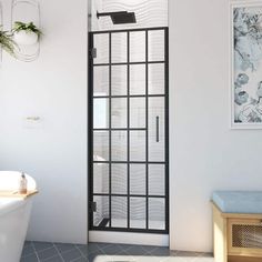 a bathroom with a white bath tub sitting next to a window