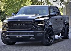 the front end of a black ram truck