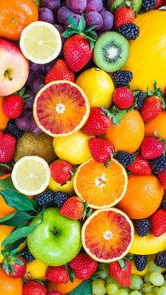 an assortment of fresh fruits are arranged in the shape of a face on top of each other