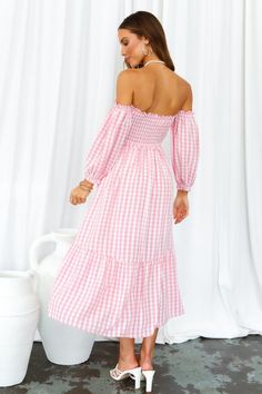 Length from neckline to hem of size S: 101cm. Pink gingham midi dress. Partially lined. Cold hand wash only. Model is a standard XS and is wearing size XS. True to size. Shirred, stretchy top. Lightweight, non-stretchy woven fabric. Adjustable shoulder straps. No zipper. Slip-on style. Rayon. Live the cottagecore dream in our Kiss Me At Sunset Midi Dress! With a sweet gingham print, off-the-shoulder sleeves and ruffled skirt, you'll be running away for a countryside life this summer. Don't forget to style yours with tousled waves, lace-up sandals and a woven bag. Gingham Maxi Dress For Picnics, Spring Plaid Midi Dress Knee-length, Spring Gingham Maxi Dress For Brunch, Fitted Gingham Midi Dress With Ruffles, Fitted Knee-length Midi Dress For Picnic, Feminine Gingham Dress For Day Out, Spring Gingham Maxi Dress, Long Sleeve Ruffled Dress For Picnic, Chic Plaid Midi Dress