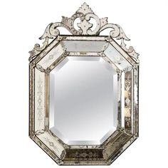 an ornate mirror is shown against a white background