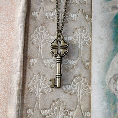 Antiqued brass key pictured on 20 inches of brass chain. I can make the necklace any length just let me know at checkout. The key is 40 mm long and 13mm wide. Metal Key Necklace Perfect As Gift, Vintage Brass Necklaces With Two Keys, Vintage Key Necklaces As Gift, Antique Gold Necklaces With Two Keys, Gold Brass Necklace With Keys, Bronze Brass Necklace With Keys, Vintage Gold Necklaces With Keys, Vintage Gold Key Necklace, Book Locket