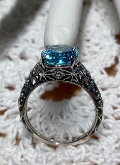 Antique Blue Topaz Round Ring, Victorian Topaz Round Ring, Victorian Style Topaz Round Ring, Victorian Round Topaz Ring, Round Topaz Ring With Intricate Design For Promise, Promise Ring With Intricate Design Topaz, Intricate Design Topaz Promise Ring, Victorian Style Silver Ring With Blue Topaz, Antique Topaz Ring With Intricate Design