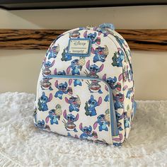 -Authentic, Brand New With Tags Loungefly Lilo And Stitch Pineapple Aop Mini Backpack -You Will Receive The Exact Bag And Placement Pictured. -Super Cute, A Fantastic Piece To Take To The Parks Or Even As An Everyday Bag! :) -Comes From A Smoke Free, Pet Free Home. -I Ship Within 1-2 Days From Purchase. -Please Request For More Photos If Needed. -Check Out My Other Items! Bundle For A Discount. Disney Backpack For Everyday Use, Disney Bags For Everyday Use And Back To School, Stitch Loungefly, Doug The Dog, Cinderella Pink Dress, Stitch Pineapple, Lounge Fly, Disney Bags Backpacks, Winnie The Pooh Honey