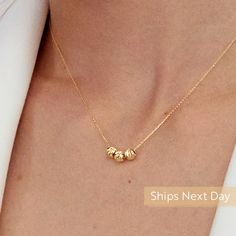 "Our 14k Gold Sphere necklace is the representation of being simple and stylish. Wear this to add triple classic touches to your outfit with a gold necklace. After all, you cannot go wrong with classics. D E T A I L S * Made to Order. * 100% 14k Solid Gold * Choice of Gold Color: Yellow Gold, Rose Gold, White Gold * Pendant Height: 5 mm / 0.19 inch * Pendant Width: 15 mm / 0.59 inch * Length: 14\", 16\", 18\", 20\", 22\" (Got a little note that can help you in the photos.) * Ready to Ship in 1-3 Timeless Round Beads Necklace For Anniversary, Timeless Round Bead Necklace For Anniversary, Elegant Yellow Gold Necklaces With Polished Beads, Elegant 14k Gold Charm Necklace For Everyday, Timeless Jewelry With Round Beads As Gift, Timeless Round Beads Jewelry As Gift, Timeless Round Beads Jewelry Gift, Timeless Round Beads Jewelry For Gifts, Everyday 14k Gold Round Beads Necklace