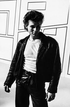 black and white photograph of a man in leather jacket