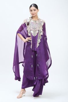 Purple organza butterfly cape with golden thread work embroidery. Comes with dupion golden thread embroidered yoke short kurta and matching dupion draped skirt. - Aza Fashions Purple Choli For Eid, Purple Mirror Work Dresses, Purple Dresses With Mirror Work, Sharara With Cape Sleeves For Navratri, Navratri Sharara With Cape Sleeves, Purple Sharara For Transitional Season, Purple Dress For Navratri, Embroidered Butterfly, Draped Skirt