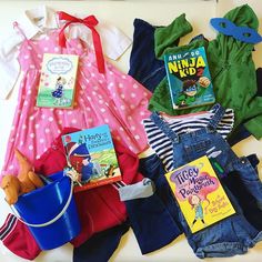 children's clothing and books laid out on a table