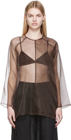 Sheer silk organza blouse. · Paneled construction · Crewneck · Single-button closure and cut-out at back Supplier color: Taupe | Áeron Taupe Dallas Blouse Sheer Organza Top, Organza Tops, Dolman Shirt, Khaki Tops, Organza Blouse, Organza Top, Black Sheer Top, Layered Blouse, Sheer Fashion